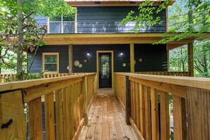 The journey to the entrance sets the tone for a tranquil stay, surrounded by the natural beauty of the forest.