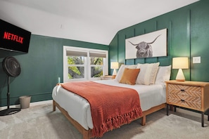 Queen bed, 40" smart TV, dedicated workspace, closet storage, black out blinds.