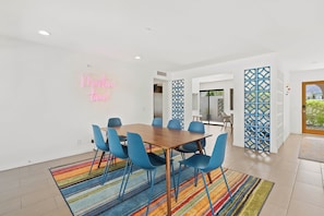 Dining area with table and seating for 8