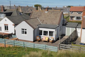 Marram Cottage Rear Garden backing directly on to sand dunes and beadnell bay