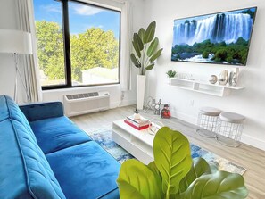 Contemporary Livingroom:
- 65” Smart TV with Roku
- Sleeper Sofa
- City View