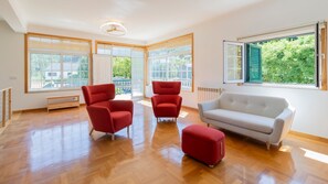 Bright and inviting living area filled with natural light, perfect for relaxing or enjoying time with loved ones. #CozyVibes #RelaxAndUnwind