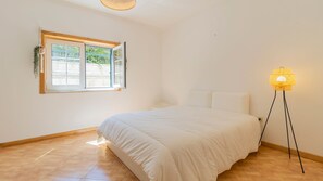 Cozy and bright bedroom featuring a comfortable double bed, ideal for a restful night's sleep in a serene atmosphere. #CozyBedroom #BrightAndAiry
