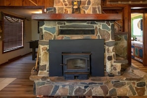 "Fireplace","Indoors","Hearth","Floor","Hardwood"