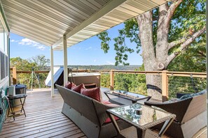 This inviting space is perfect for enjoying meals surrounded by nature, offering a serene atmosphere for breakfast, lunch, or dinner. Share delicious food and memorable moments with family and