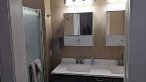 Mahogany King Size Bedroom attached bathroom 2 sinks, shower and toilet 