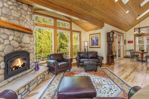 Floor-to-ceiling glass windows in the living area