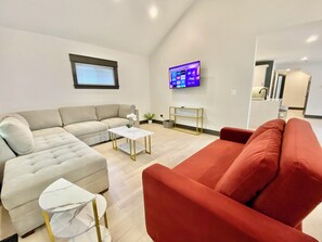 Living room with L-Shape couch and sofa bed