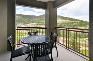 Private balcony with breathtaking views, perfect for morning coffee.