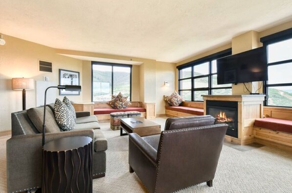 Spacious living room with large windows offering great views