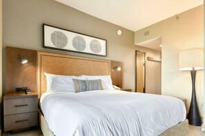 Comfortable bedroom with a king-size bed and ambient lighting.