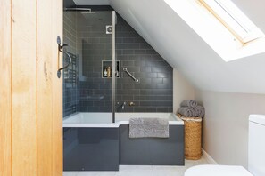 A beautiful bathroom stocked with fresh towels for your stay.