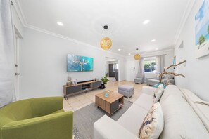 Step into your serene retreat! This beautifully designed living room combines comfort and elegance, perfect for relaxation and entertaining.