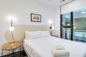 Primary bedroom features a queen bed and an ensuite bathroom.