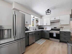 Oversized fridge. Keurig coffee bar provided