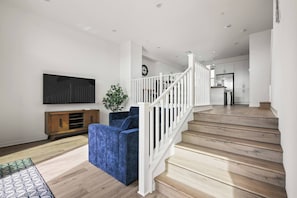 Vinyl stairs w/comfy couches and Smart TV