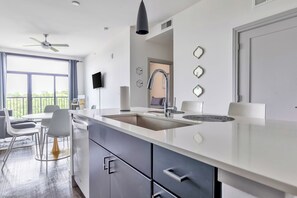 Open-concept kitchen with stylish island seating, perfect for casual meals and socializing.