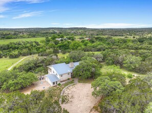 This home boasts 30 acres of mature trees.