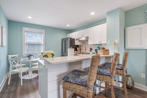 Cozy coastal breakfast bar, perfect for casual meals or morning coffee.