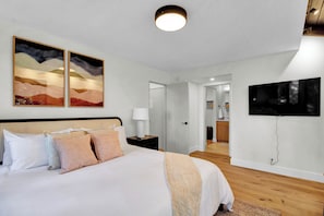 Master bedroom with King size bed and 50-inch TV! Private deck adjacent