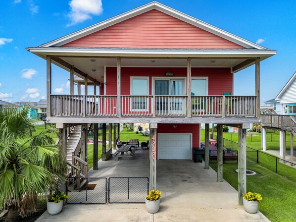 Step into coastal comfort with this charming beach house. 