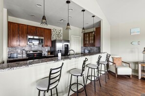 Bar seating with 4 tall chairs. 