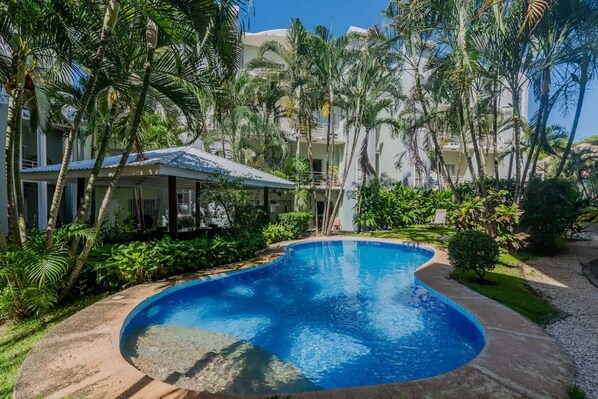 2 pools availabale with a covered barbecue area  .