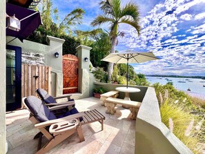 Relax on the patio in the reclining Adirondack chairs with footrests