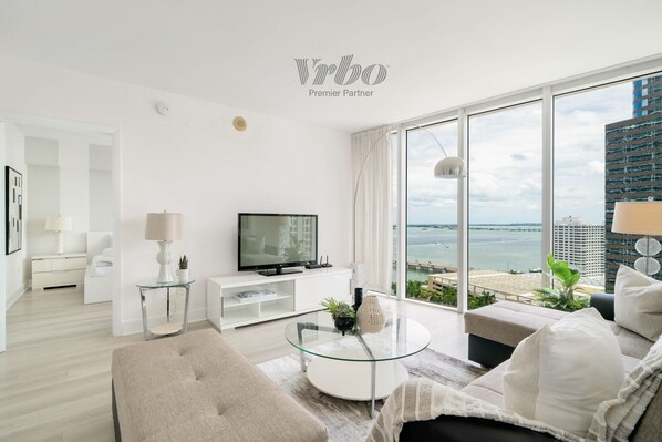 Spacious living room with abundant natural light from large windows!