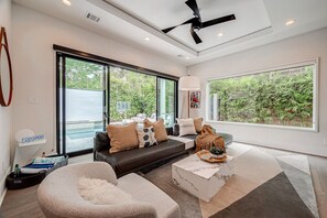 Living room / entertainment center looking out to the pool
