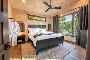 Master bedroom with king sized bed and slider out to porch!