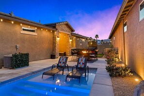 Private pool with beautiful lights & seating.