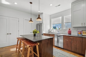 kitchen on second floor stainless appliances, gas stove