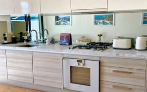 Fully equipped kitchen with Gaggenau appliances and integrated full size fridge