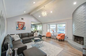 With an air of sophistication, this living room’s high ceilings, stylish interior, and comfortable furniture is a space for you to sit back, put up your feet, and enjoy.