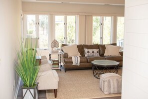 Light, bright family room overlooking the lagoon and golf course