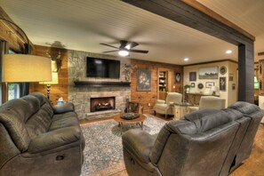 Living room with comfy furniture in front of flat screen smart tv
