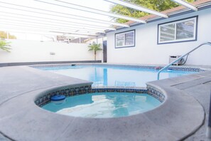 Private lap pool Illuminated by vibrant solar lights from dusk to dawn