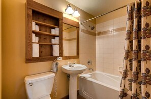 Cozy bathroom with a warm, rustic touch.