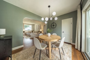 Gather in the modern and charming dining room, complete with a large sliding glass door to the backyard. It’s the perfect spot for shared meals or a lively evening of games with family and friends.