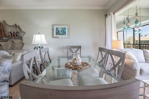 Grand Glass topped Dining Table for 6 lets you entertain and dine with a view