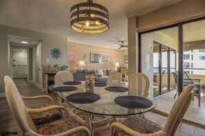 Dining Area has a lovely glass topped table for 6 and a beautiful view of the beach