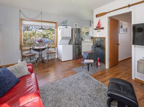 Living room and laundry machines. 
(Fireplace is no longer present)