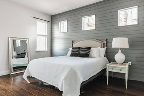 master bedroom with a king bed, a single bed