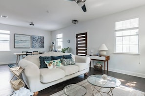 Living room with comfy sofa spacious sitting area