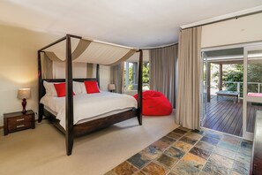 Main ensuite bedroom with king size poster bed