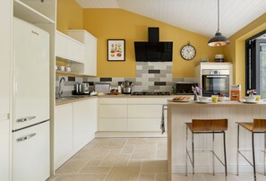 The sleek modern kitchen is well-equipped for preparing delicious meals