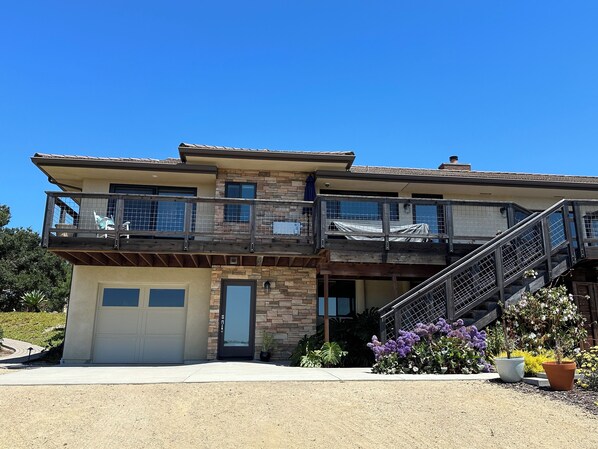 Large deck overlooking property and valley with views to the ocean