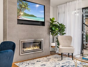 Living Room: Feature gas fireplace and Smart TV with Bluetooth Sound System.