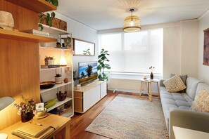 LIVING ROOM: the Living Room has a comfortable couch, Smart TV, Bluetooth speaker and sensational bay and beach view.
